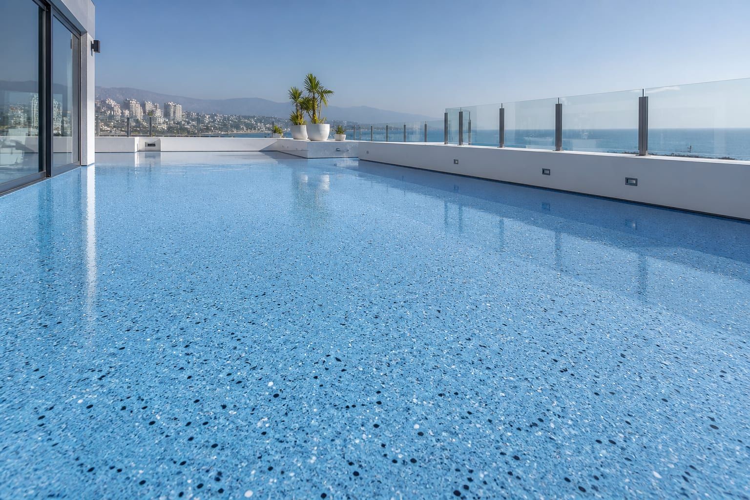 Polished sky-blue terrazzo terrace with fine aggregate speckles